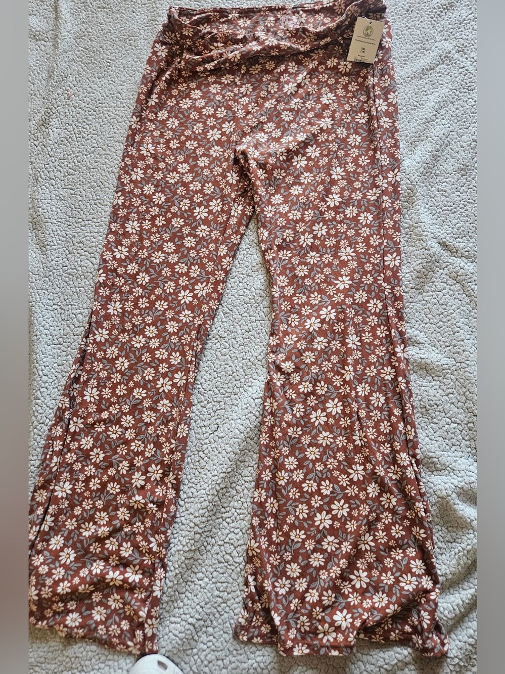 No Boundaries clay-colored pants / white daisy floral print flare leg design